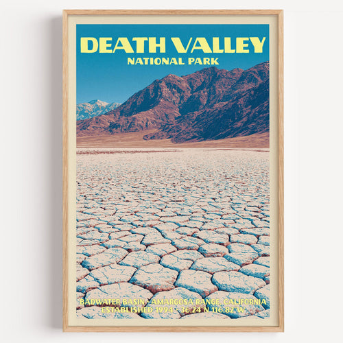 Badwater Basin Death Valley vintage poster in a light oak frame on a plain white wall