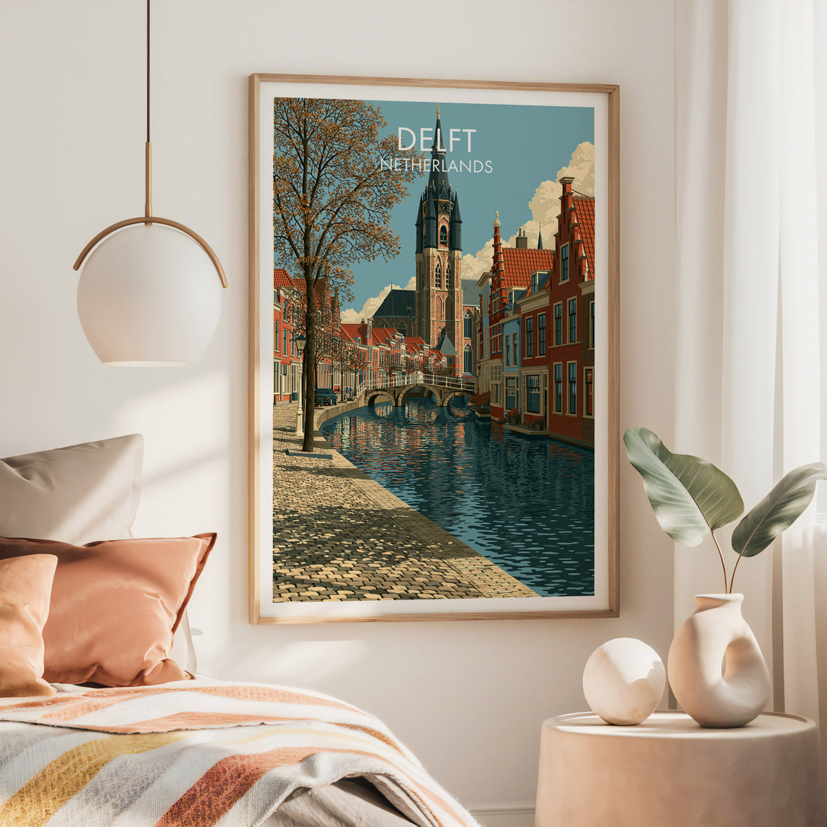 Delft Netherlands wall art, large oak frame above a bed with rust bedding and a brass globe pendant