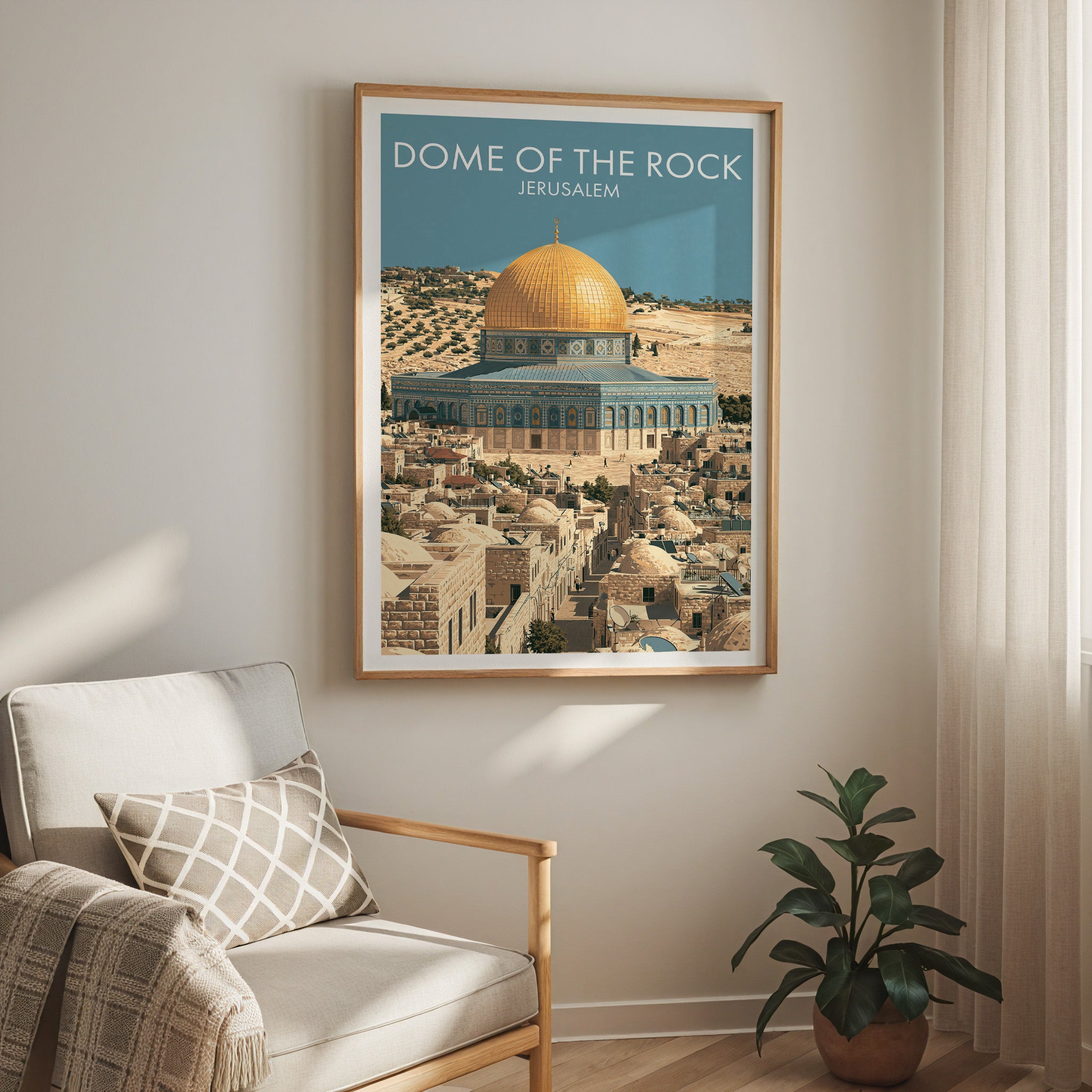 Dome of the Rock Jerusalem travel print in a light oak frame on a living room wall beside a linen armchair