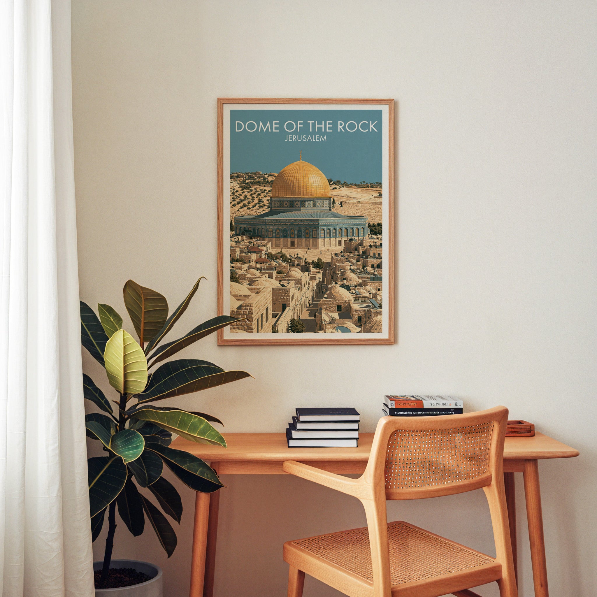 Dome of the Rock Jerusalem wall art above a wooden home office desk with a rattan chair and books