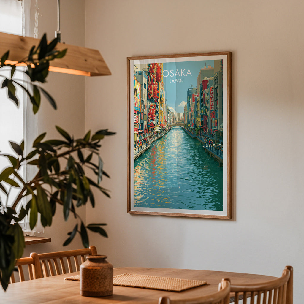 Framed Dotonbori Osaka Japan print on a dining room wall above an oak table in warm afternoon light