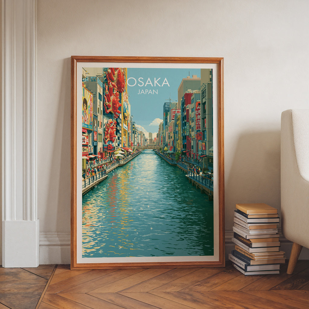 Dotonbori Osaka Japan art print in a walnut frame leaning in a hallway beside stacked books