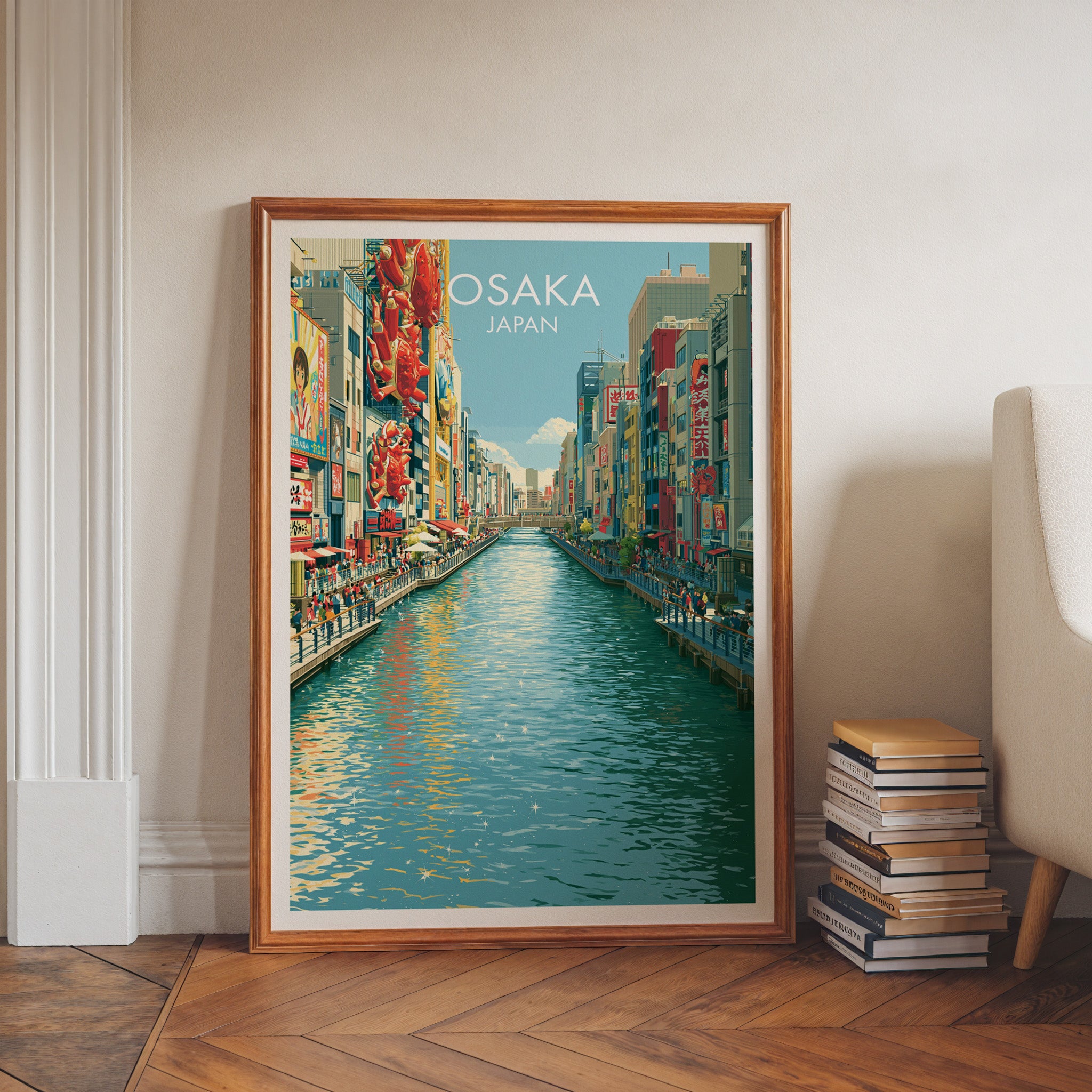 Dotonbori Osaka Japan art print in a walnut frame leaning in a hallway beside stacked books