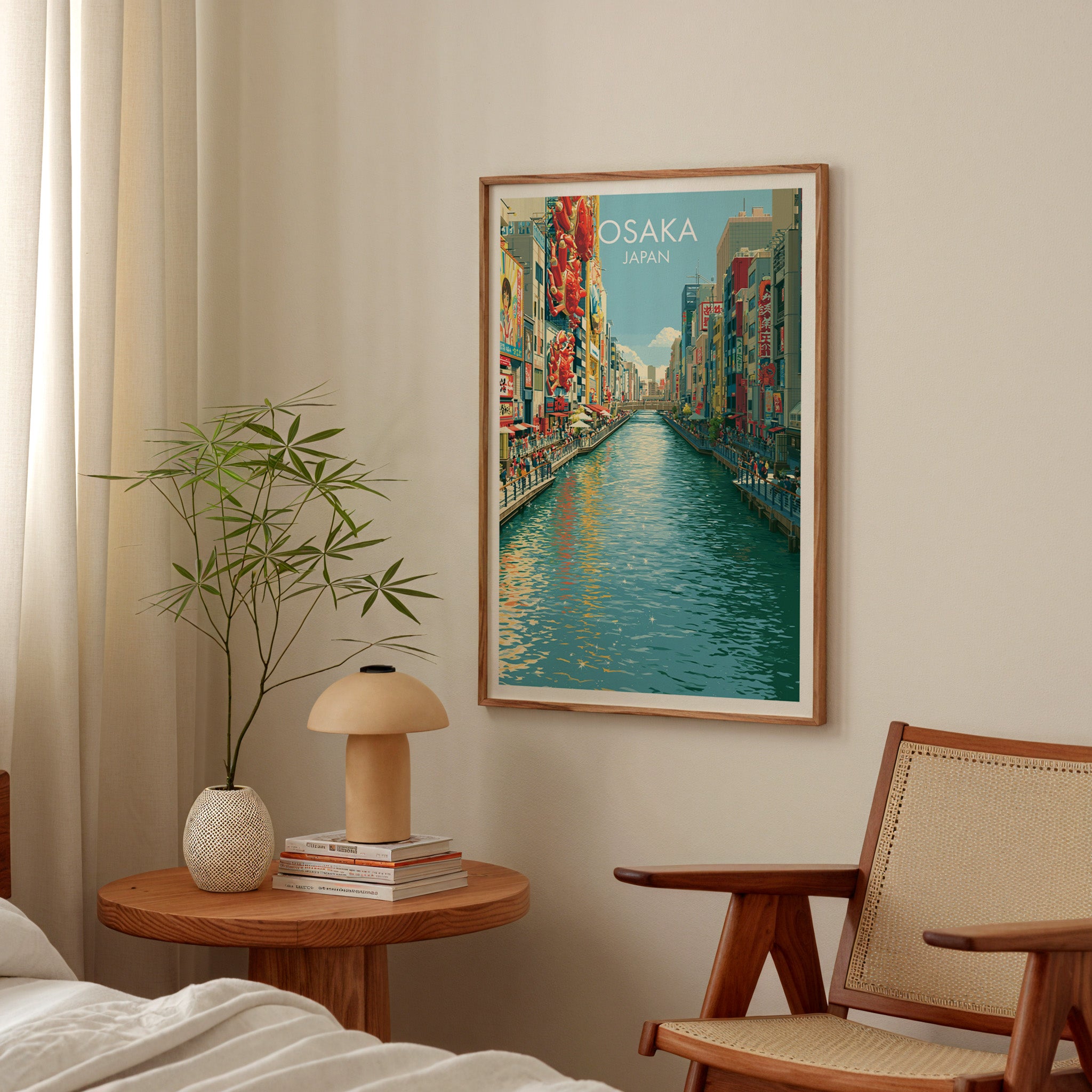 Dotonbori Osaka Japan poster above a bedroom nightstand with a bamboo plant and mushroom lamp
