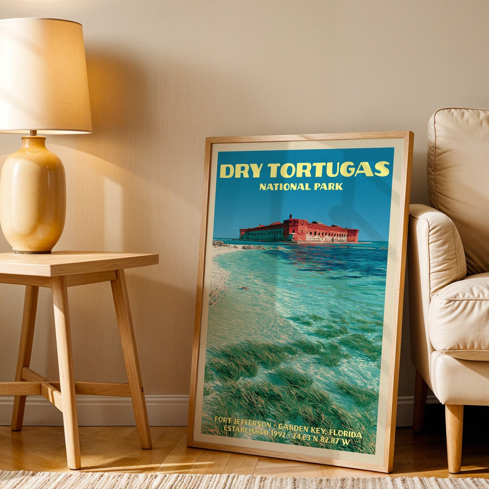 Fort Jefferson Dry Tortugas wall art in oak, leaning by an armchair and a side table with an ochre lamp