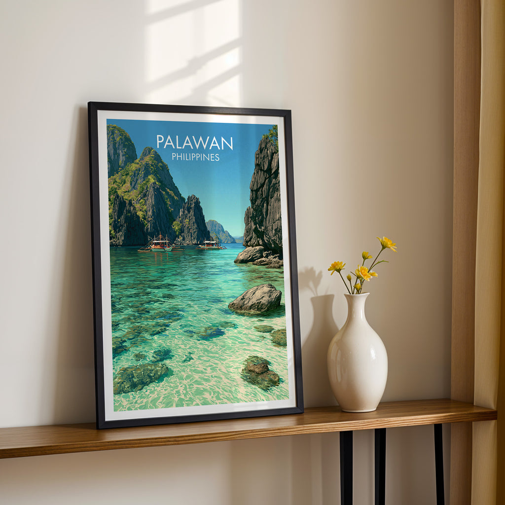 Black framed El Nido Palawan Philippines print on a narrow hallway console in sunlight, styled with yellow flowers