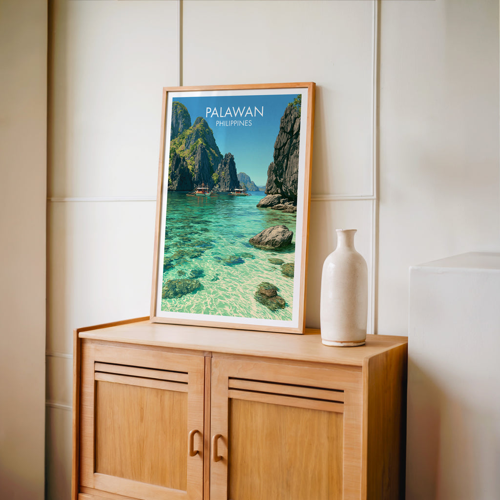 Small El Nido Palawan Philippines travel poster in an oak frame on a mid-century sideboard with a ceramic vase