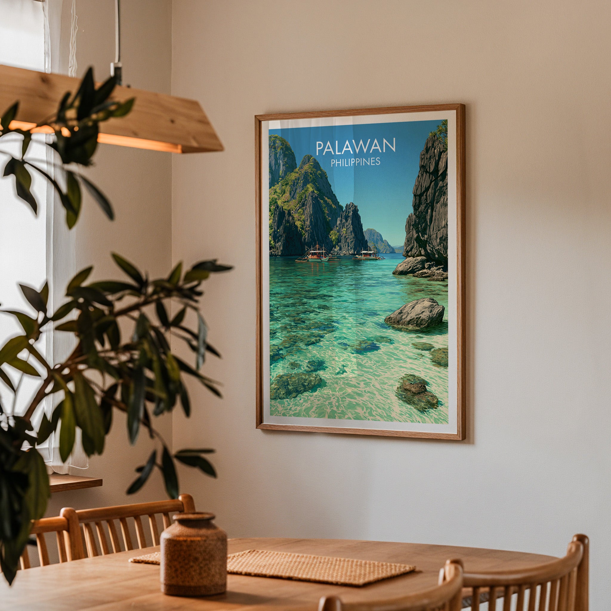 Framed El Nido Palawan Philippines print on a dining room wall above an oak table in warm afternoon light