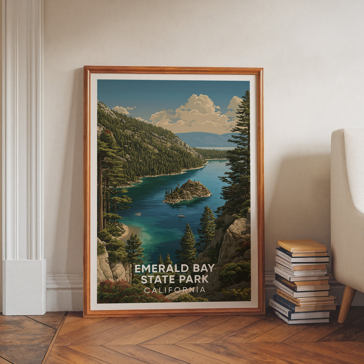 Emerald Bay print in a walnut frame leaning on a white wall above books, herringbone floor