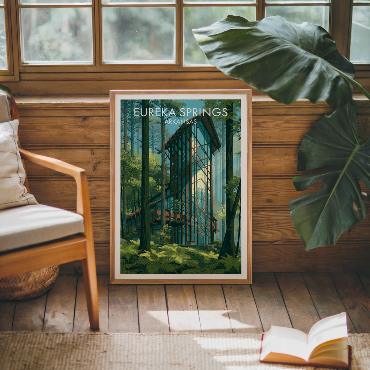 Eureka Springs travel print in an oak frame on a wood-grain wall by a mid-century armchair and thick rug