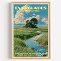 Shark River Slough Everglades vintage poster in a light oak frame on a plain white wall