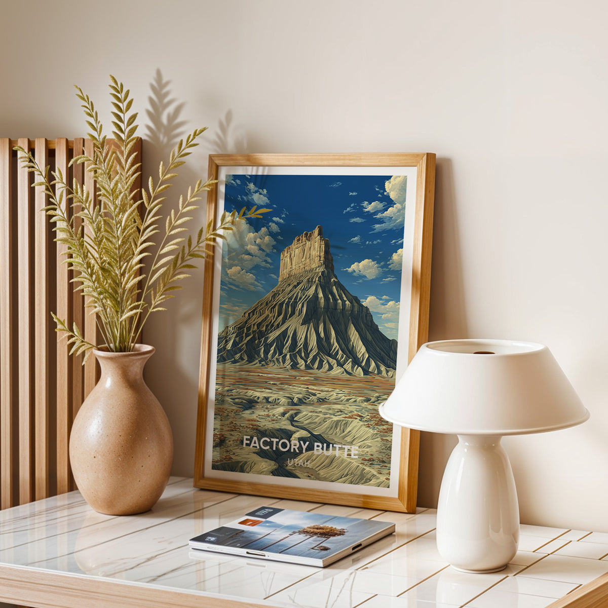 Factory Butte wall art in oak on a balanced stone table with a dome lamp, dried leaves and magazines.