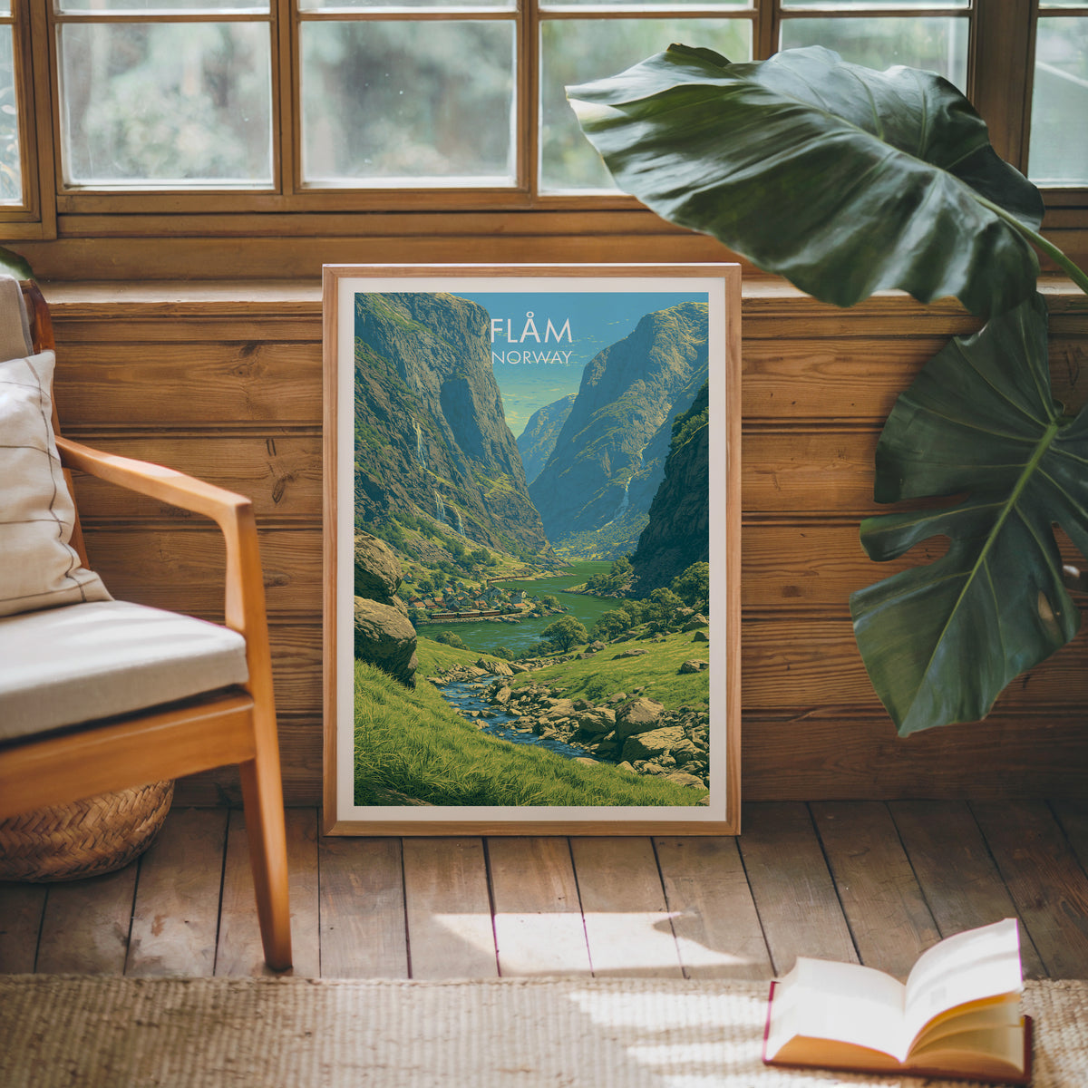Flåm travel poster, oak frame leaning on a wood-panelled sunroom wall by a mid-century armchair