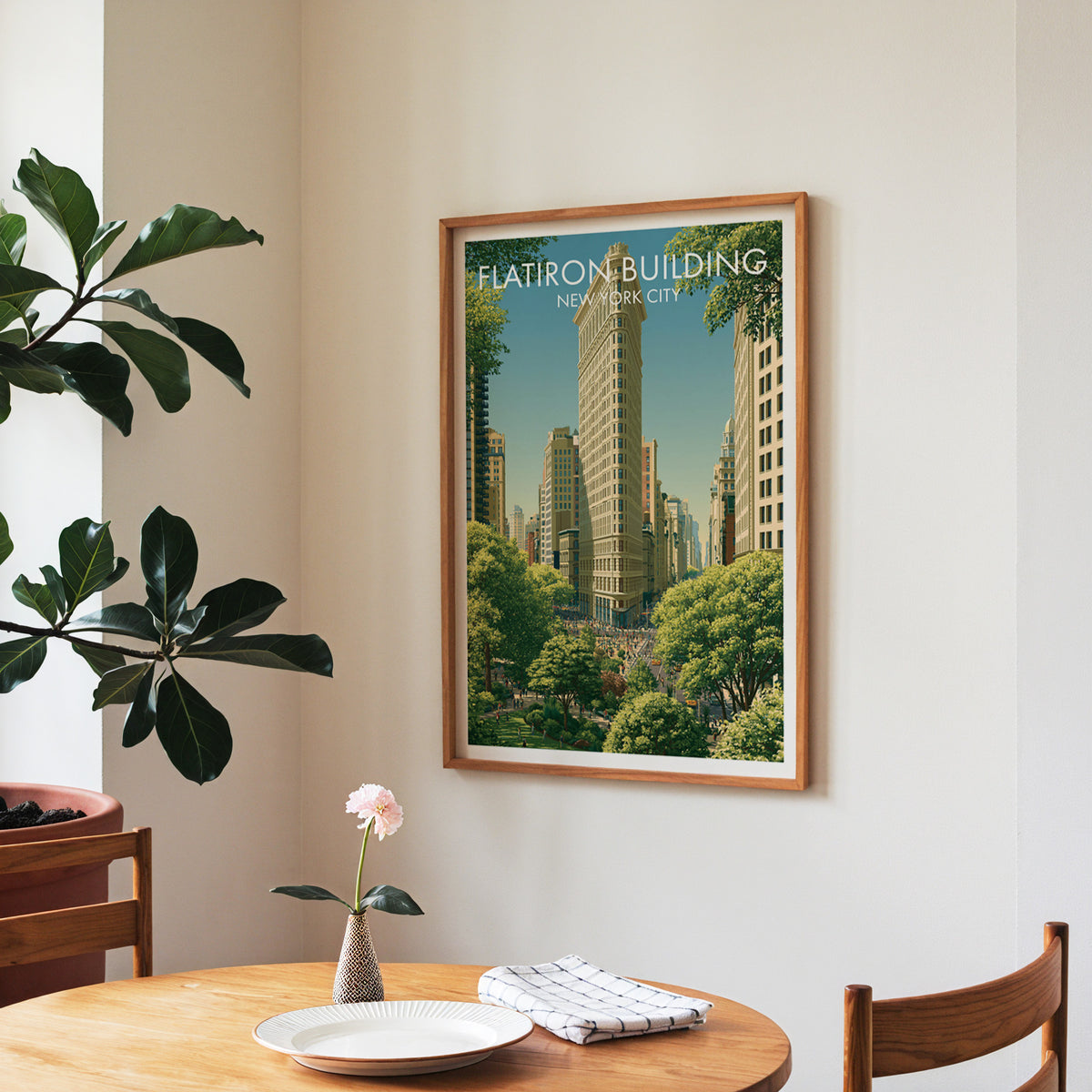 Flatiron Building wall art in a walnut frame in a dining nook with a checked runner and roses