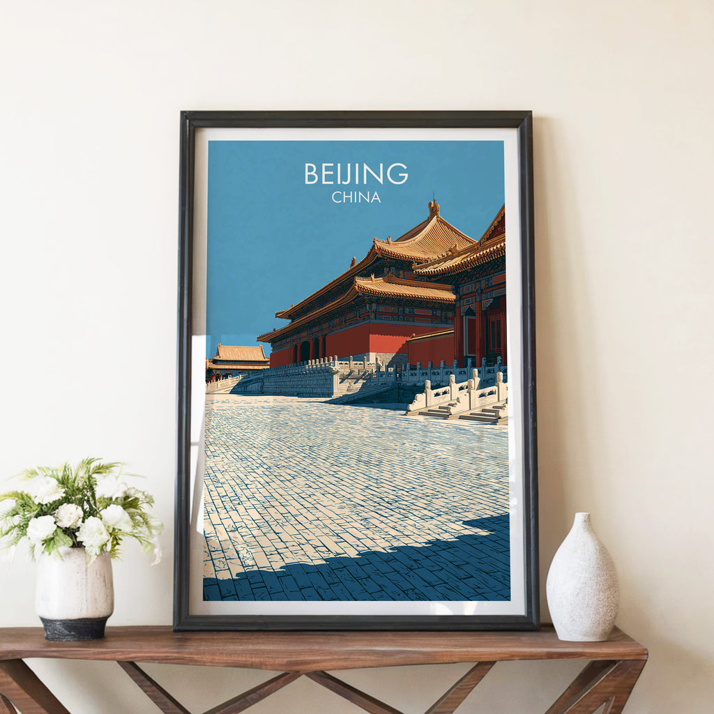 Forbidden City Beijing China travel poster in a black frame on a wooden console table with white flowers