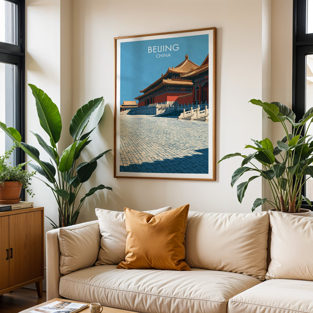Framed Forbidden City Beijing China wall art hanging above a cream sofa in a bright living room with tropical plants