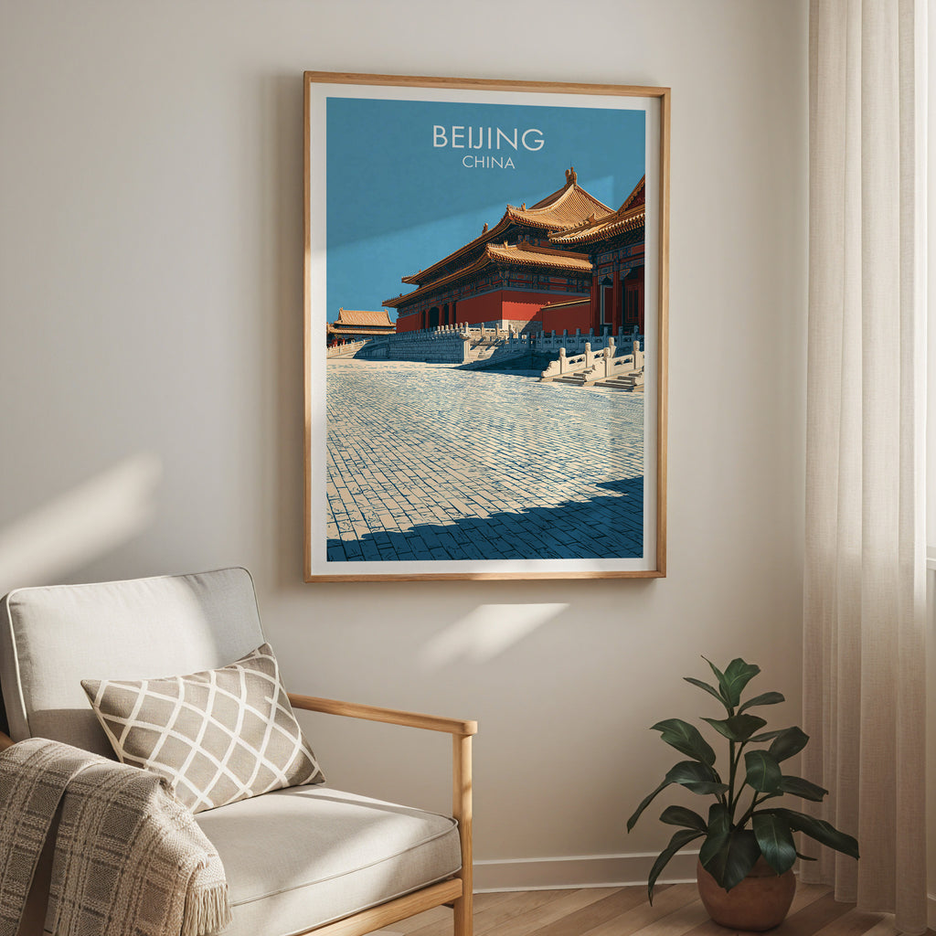 Forbidden City Beijing China travel print in a light oak frame on a living room wall beside a linen armchair