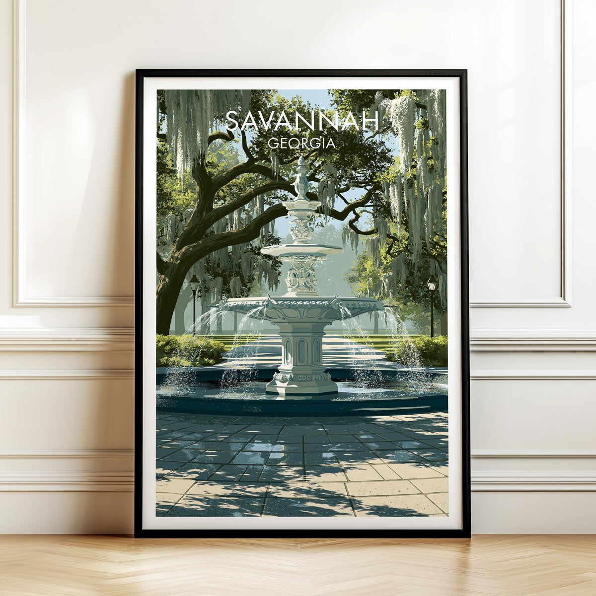 Forsyth Park canvas print in a black frame leaning on a panelled white wall above a herringbone floor.