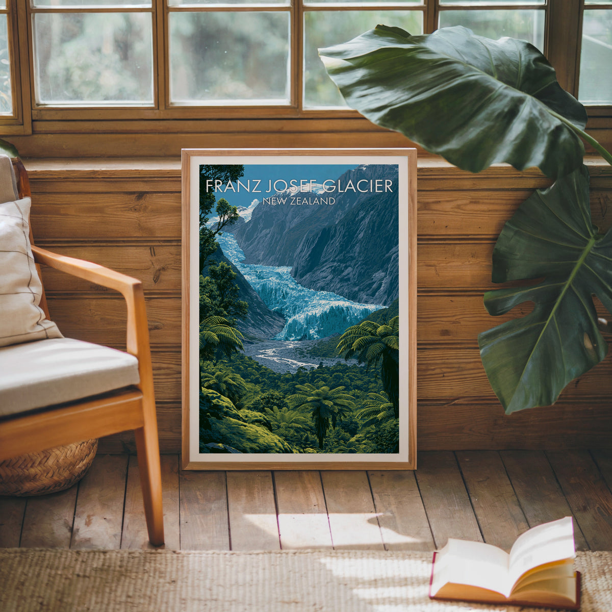 Oak-framed glacier print leaning on a pine cabin wall with a wooden armchair and open book on jute