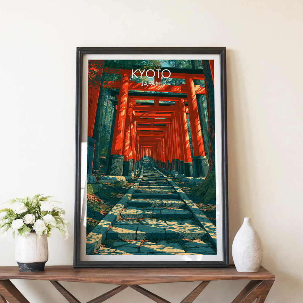 Fushimi Inari Kyoto Japan travel poster in a black frame on a wooden console table with white flowers