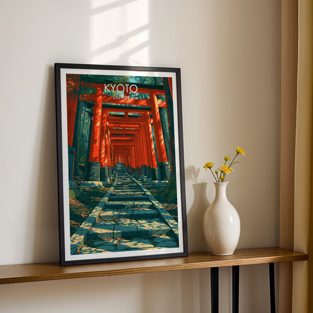 Black framed Fushimi Inari Kyoto Japan print on a narrow hallway console in sunlight, styled with yellow flowers