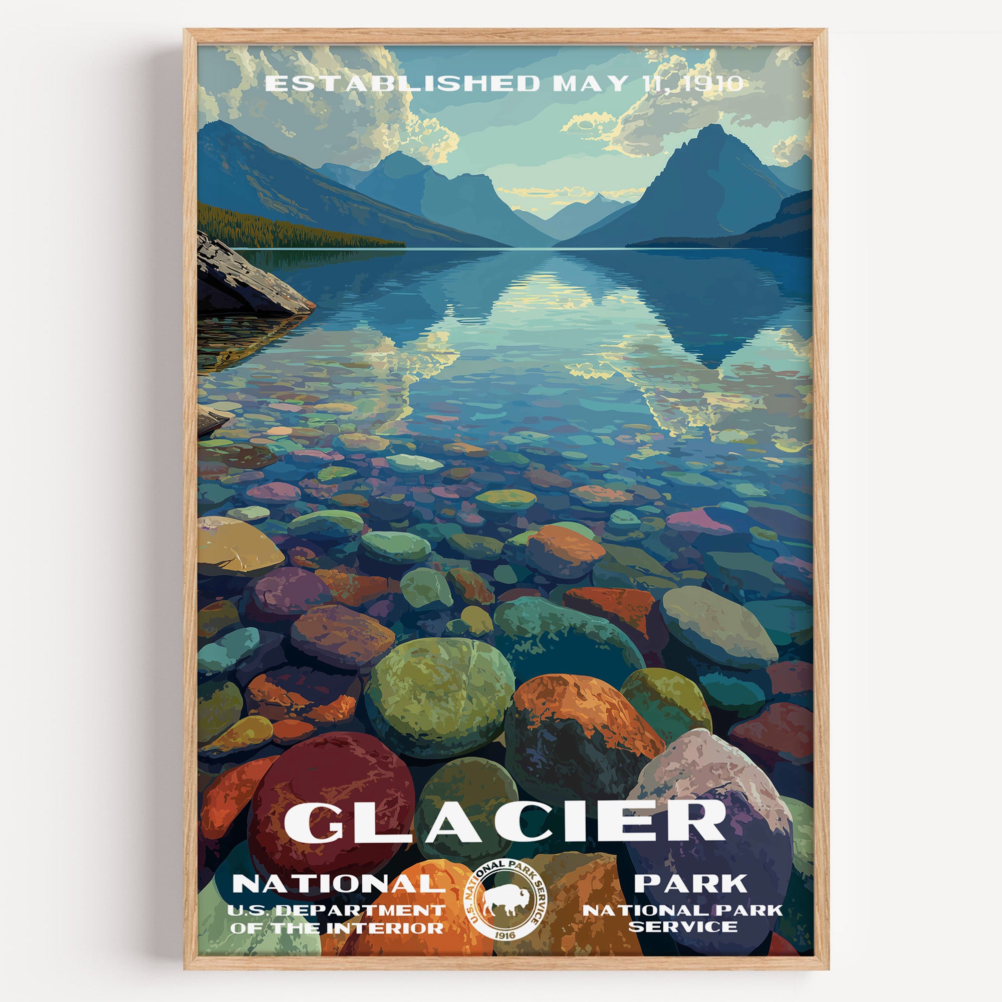 Glacier National Park vintage travel poster in a wood frame, coloured pebbles under the clear shallows of Lake McDonald