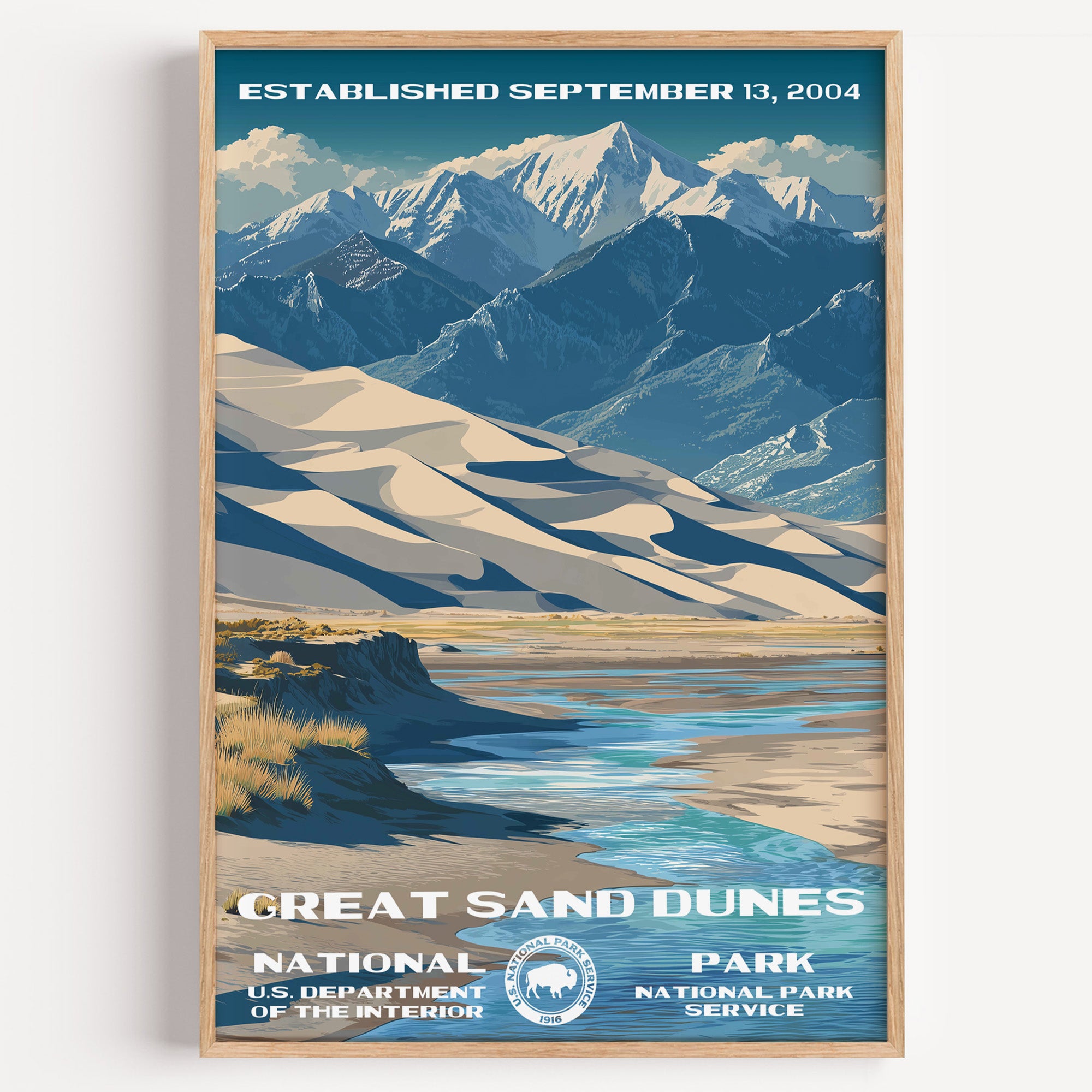 Great Sand Dunes National Park vintage travel poster in a wood frame, pale dunes below the snow-capped Sangre de Cristo range