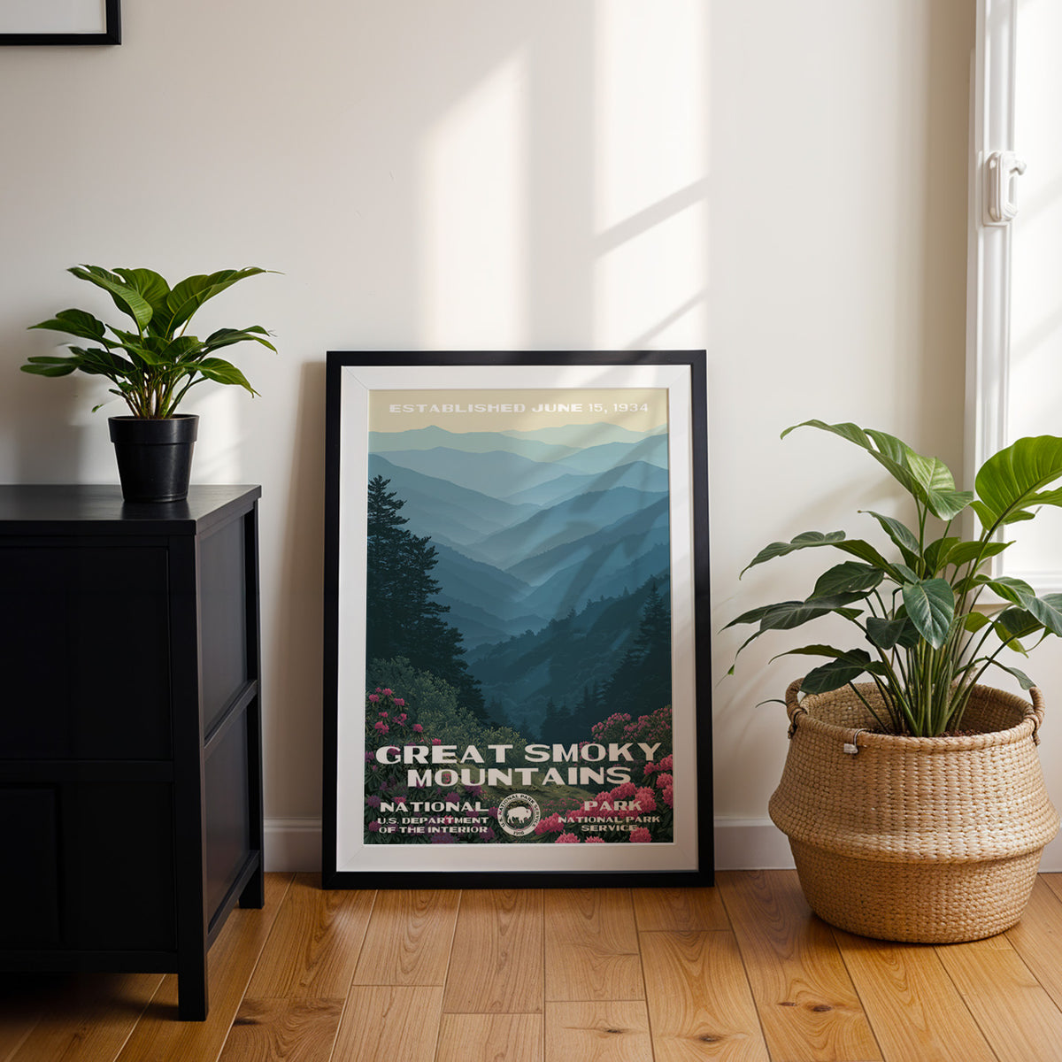 Great Smoky Mountains National Park travel poster in a black frame leaning by a dark cabinet and plants