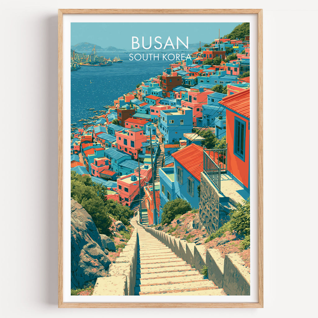Gamcheon Culture Village Busan travel poster in a natural wood frame, shown against a clean white wall