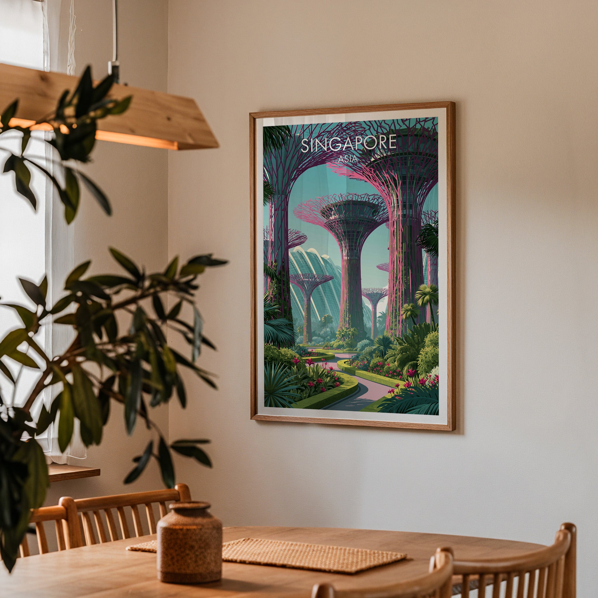 Framed Gardens by the Bay Singapore print on a dining room wall above an oak table in warm afternoon light