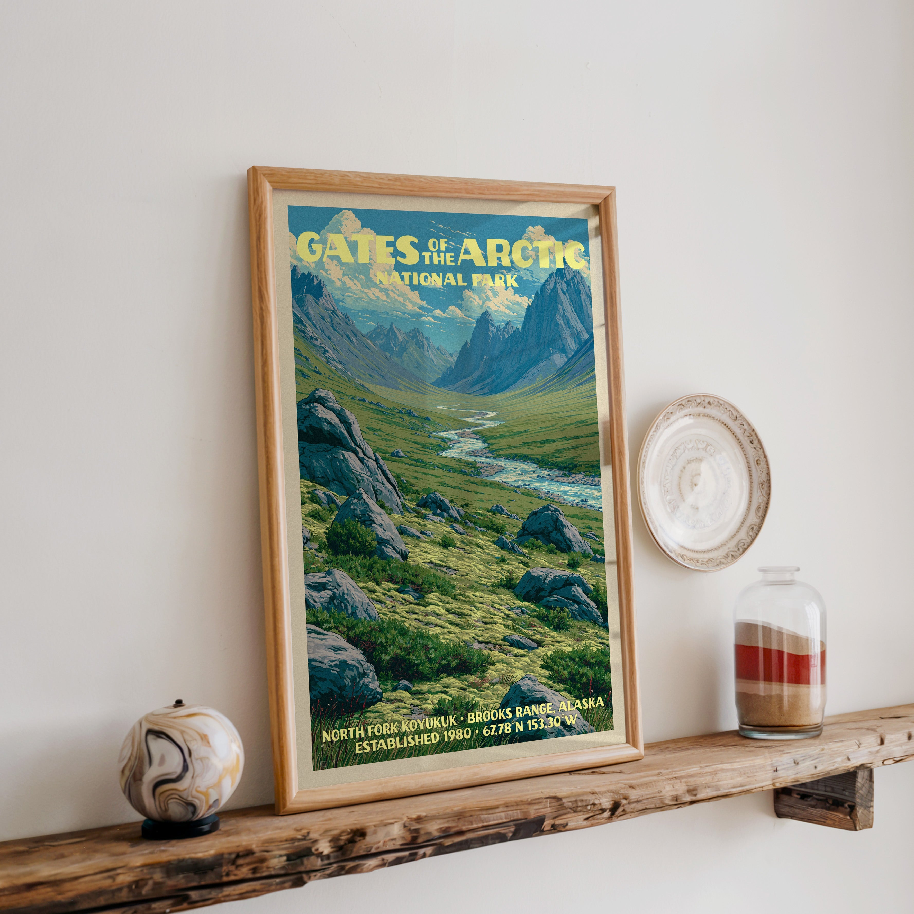 Gates of the Arctic print in oak, leaning on a reclaimed wood ledge with a marbled sphere and sand jar