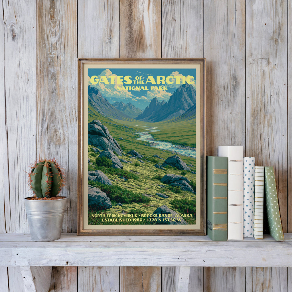 Gates of the Arctic vintage poster in a slim gold frame on a whitewashed plank wall with a cactus and books