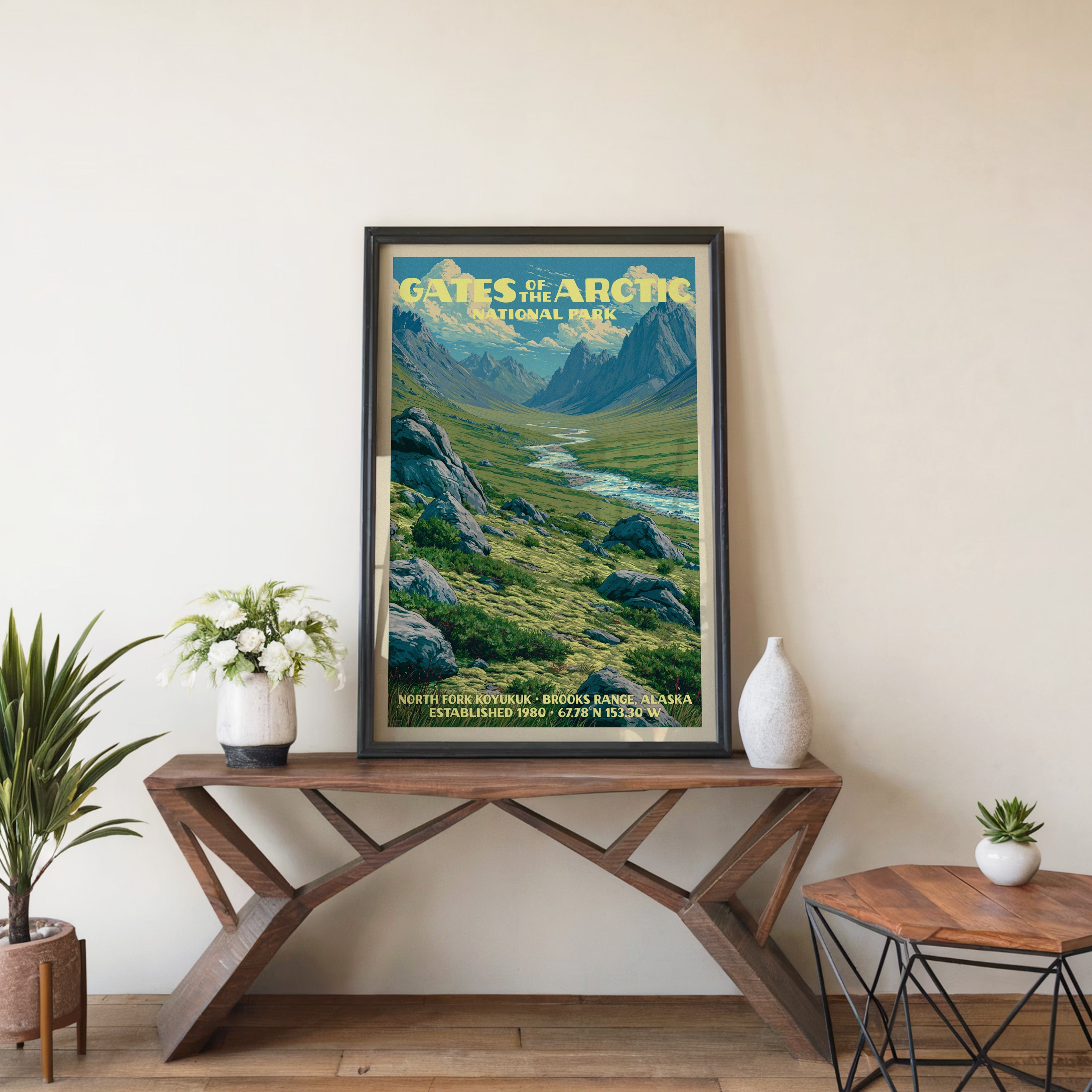 Gates of the Arctic Koyukuk wall art in black, leaning on a walnut console with white anemones in a vase