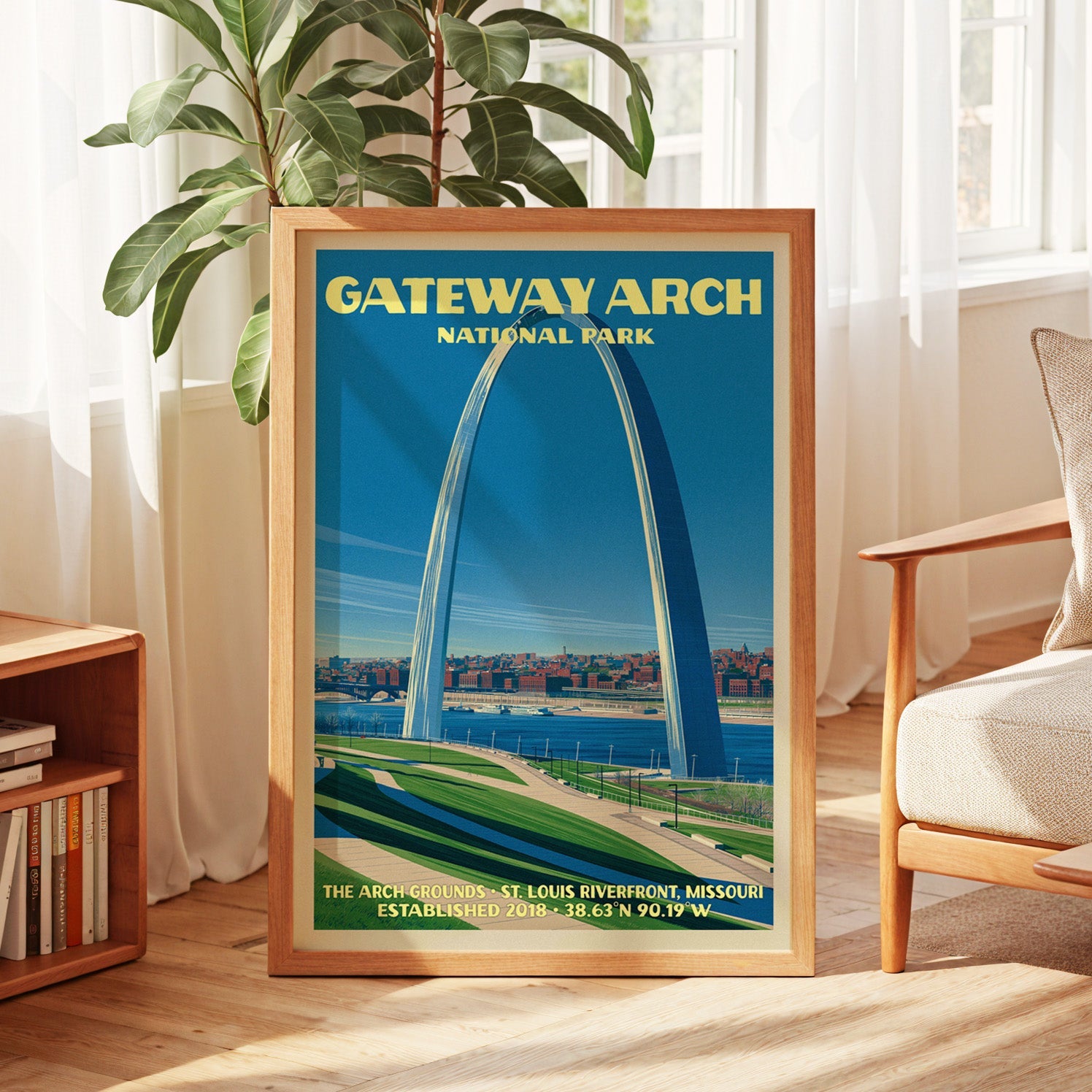 Gateway Arch vintage poster in oak, leaning by a sunlit window with sheer curtains and a low bookshelf