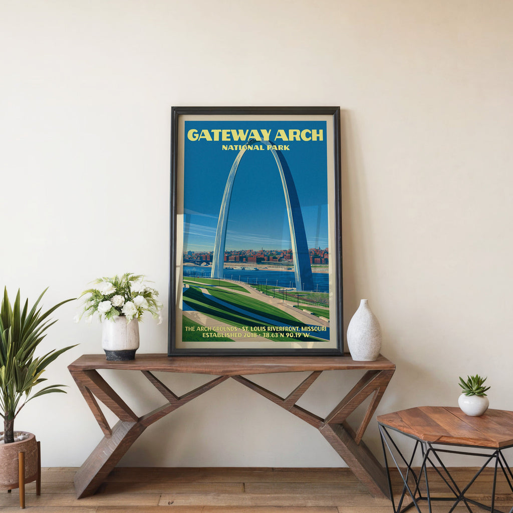 Gateway Arch St. Louis wall art in black, leaning on a walnut console with white anemones in a ceramic vase