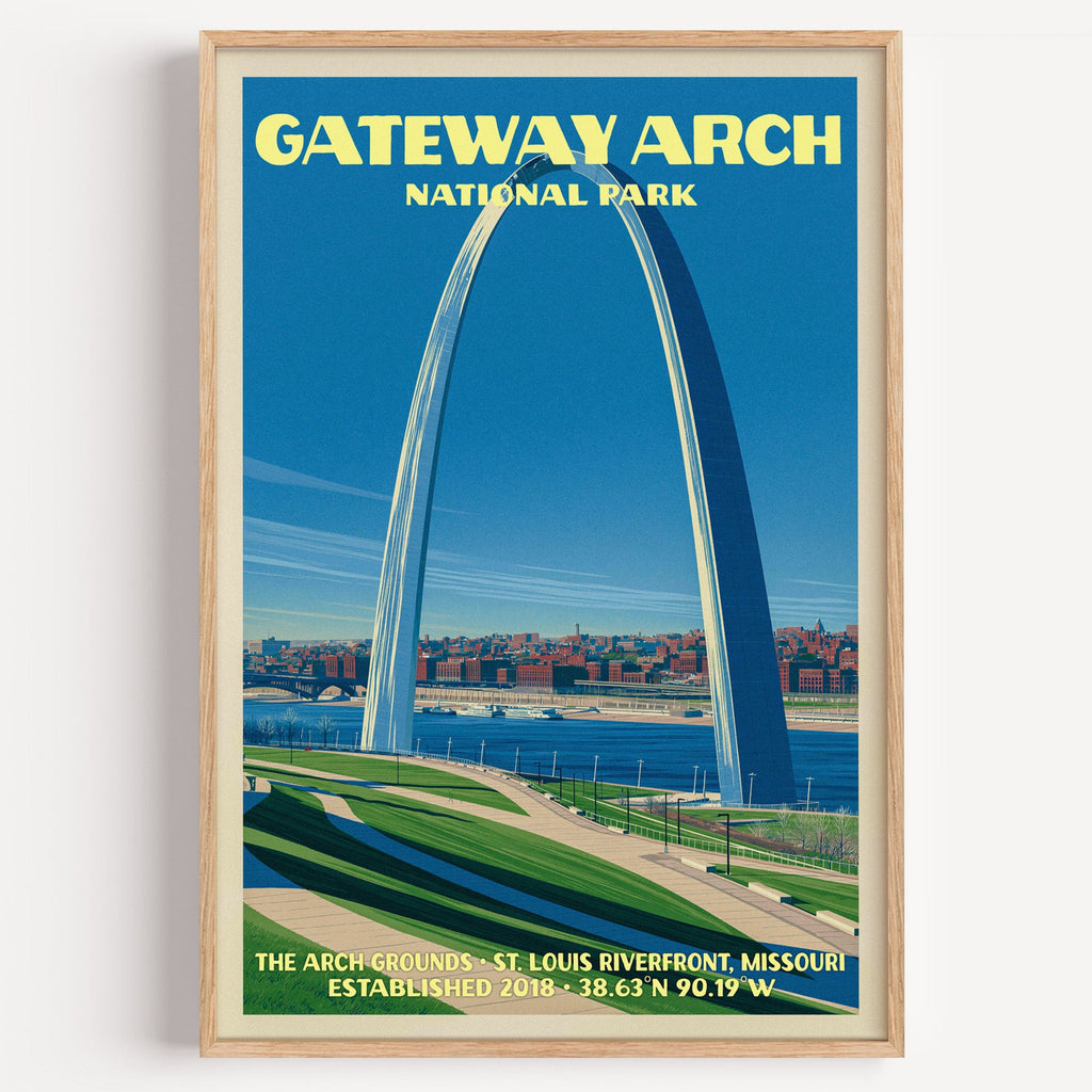 Gateway Arch St. Louis vintage poster in a light oak frame on a plain white wall