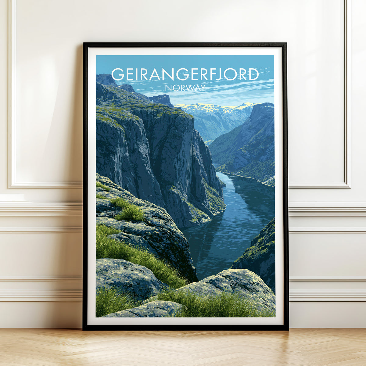 Geirangerfjord print, black frame leaning on a white panelled wall above a herringbone floor
