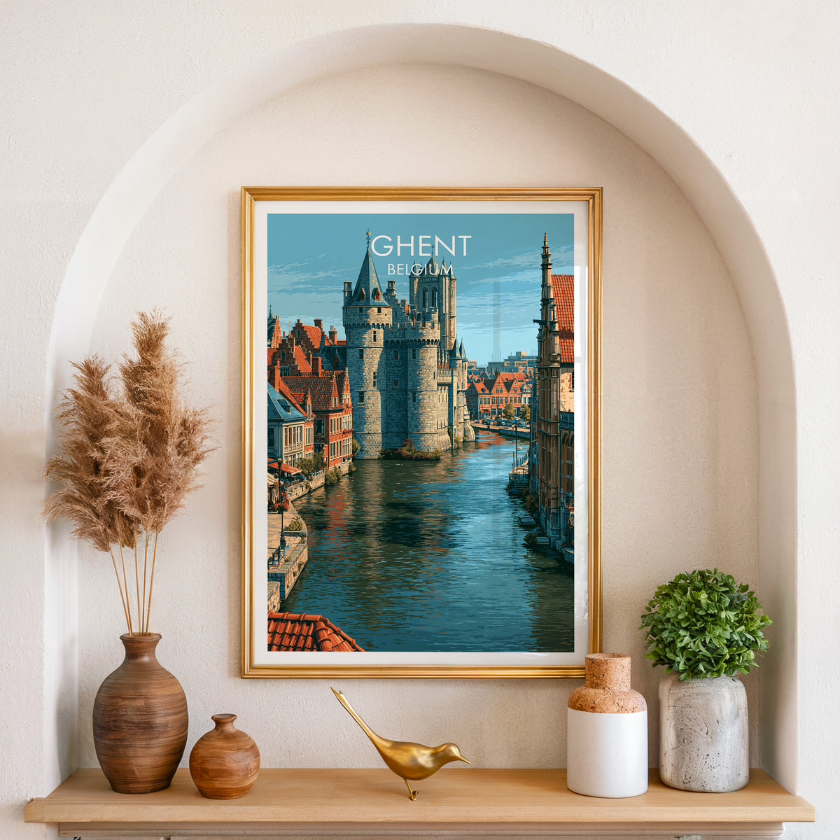 Gravensteen Castle poster, gold frame in an arched wall niche above pampas grass in a clay vase