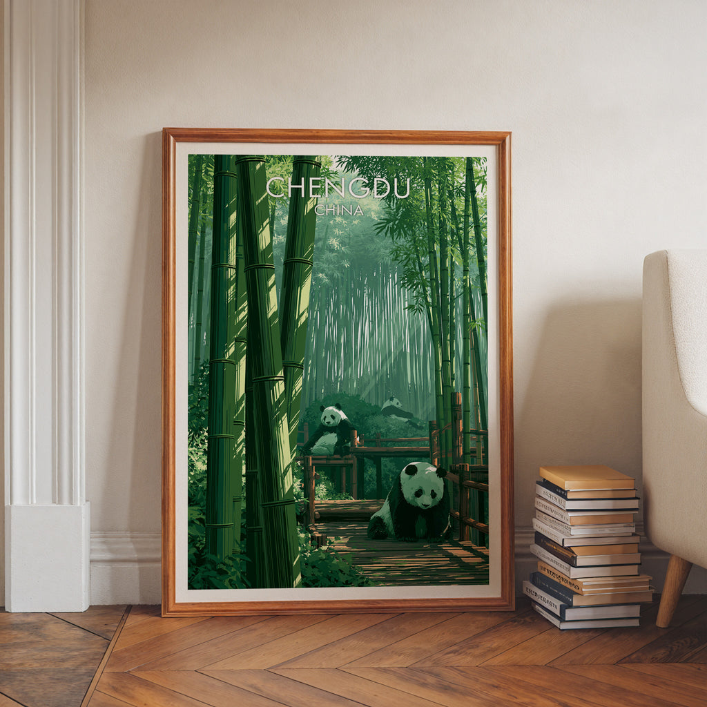 Giant Pandas Chengdu China art print in a walnut frame leaning in a hallway beside stacked books