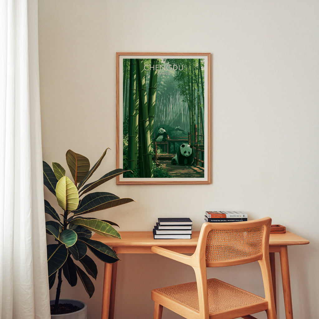 Giant Pandas Chengdu China wall art above a wooden home office desk with a rattan chair and books