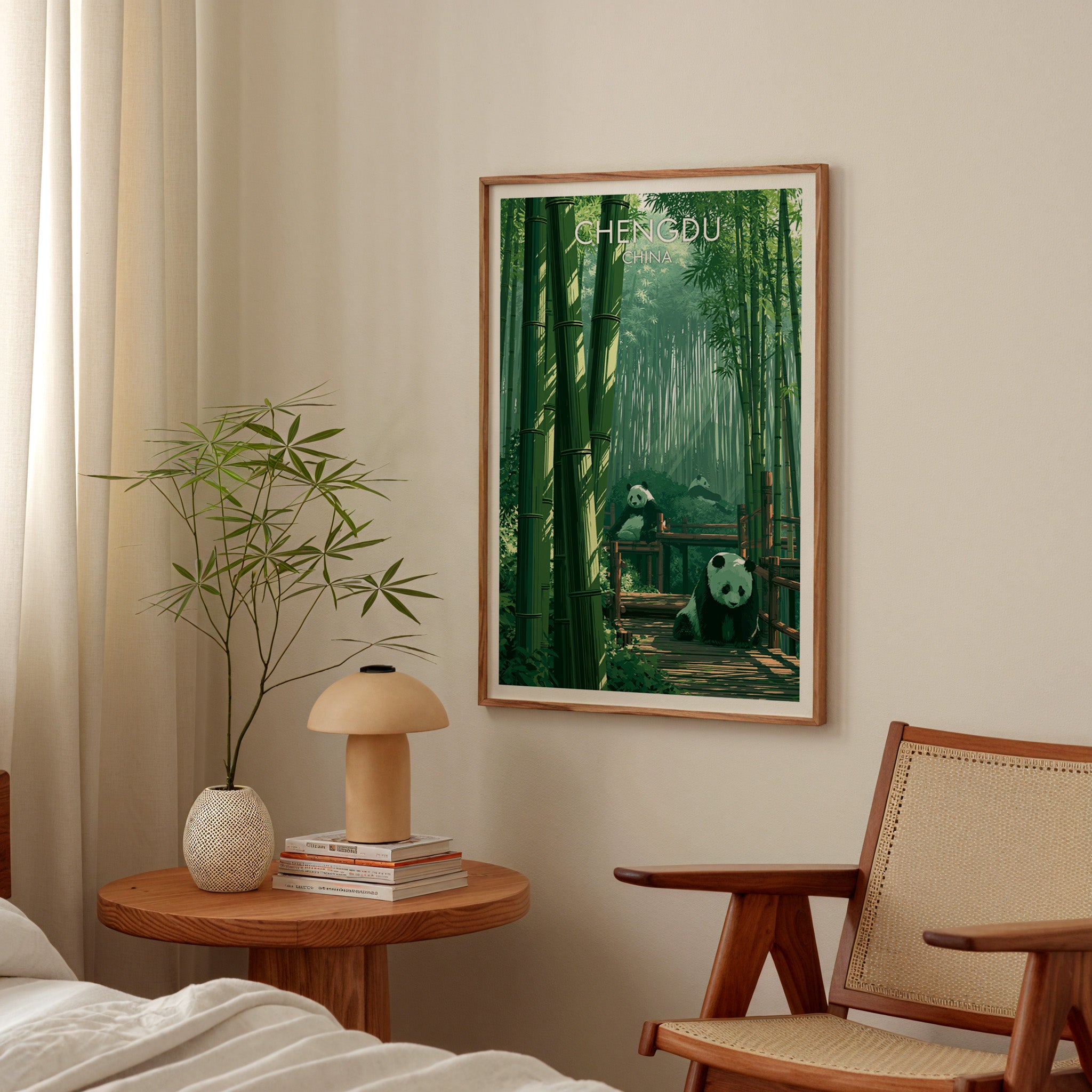 Giant Pandas Chengdu China poster above a bedroom nightstand with a bamboo plant and mushroom lamp