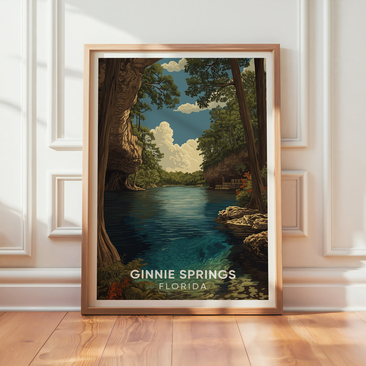 Turquoise river travel print in oak leaning on a textured white wall with sunlight across the wood floor