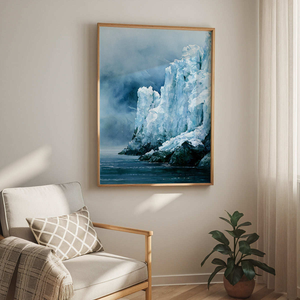 Oak-framed Glacier Bay National Park watercolor print hung above a cream armchair in a bright living room