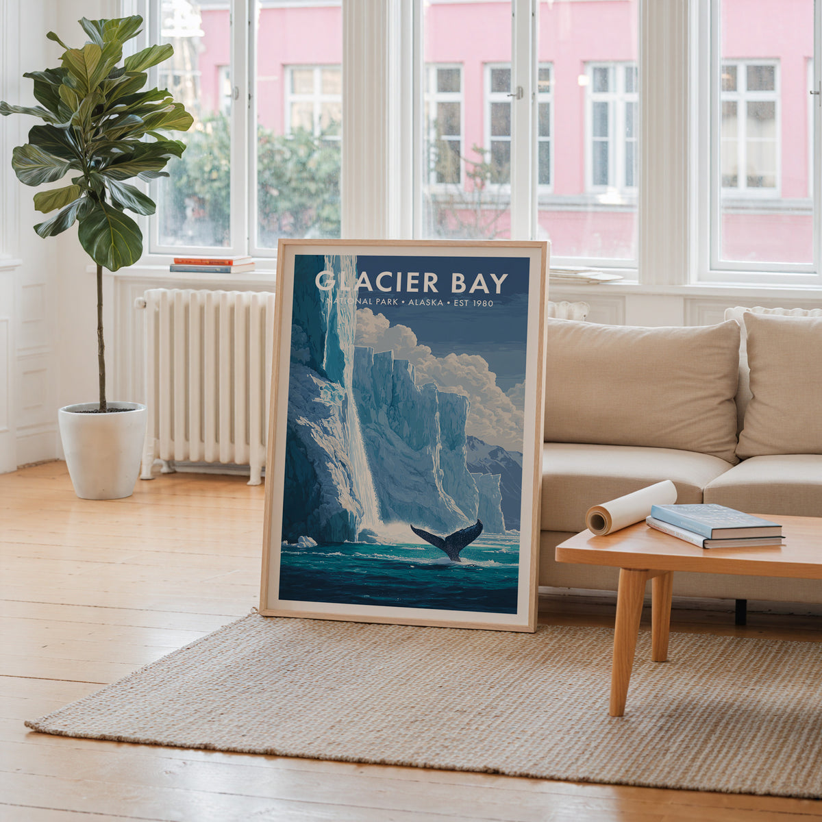 Glacier Bay National Park mid-century modern art print propped in a neutral living room behind a low oak coffee table — living room wall art