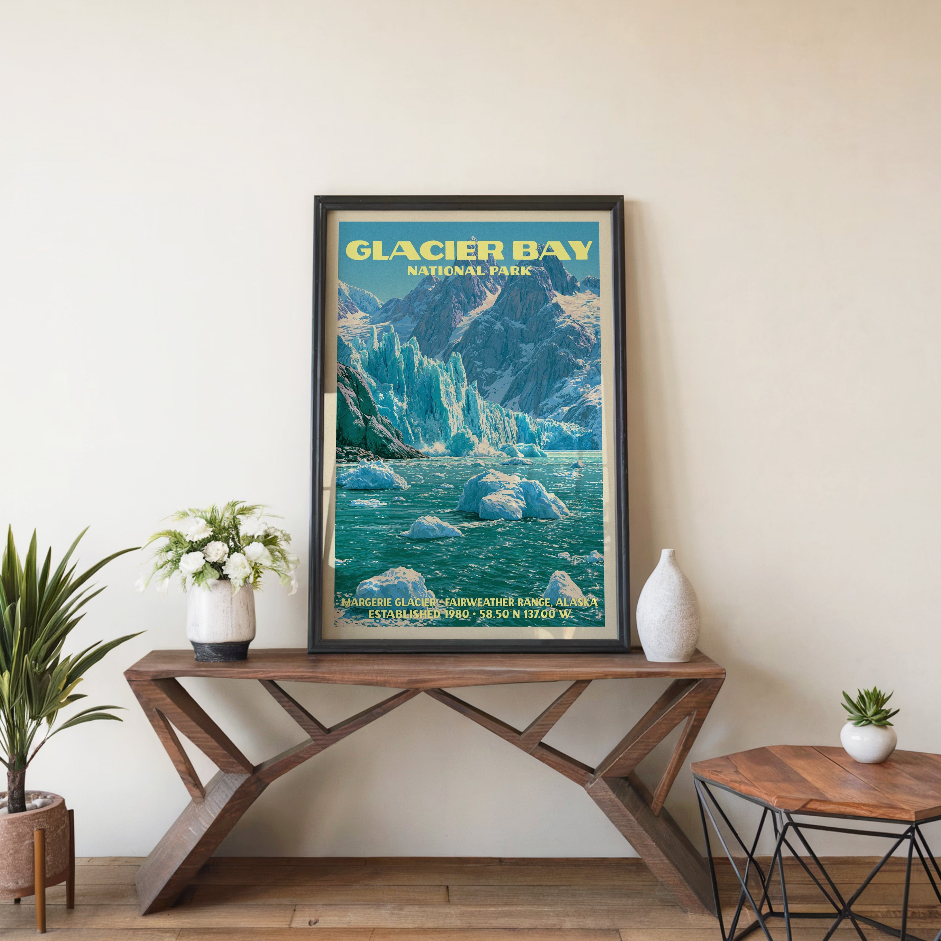 Glacier Bay Margerie Glacier wall art in black, leaning on a walnut console with white anemones in a vase