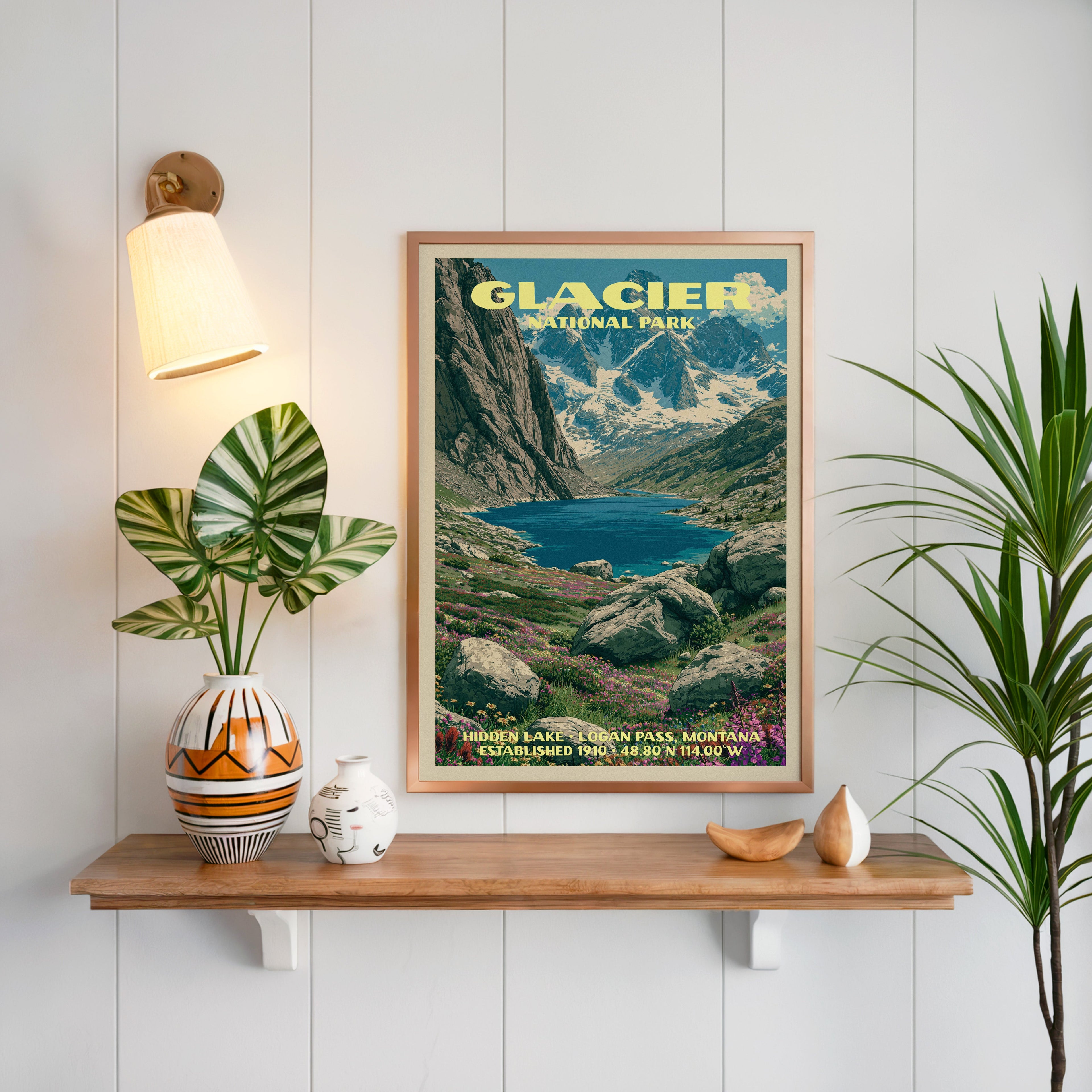 Hidden Lake print framed on white panelling above an oak shelf with a patterned vase and a brass sconce