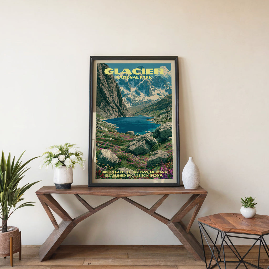 Hidden Lake Logan Pass wall art in black, leaning on a walnut console with white anemones in a ceramic vase