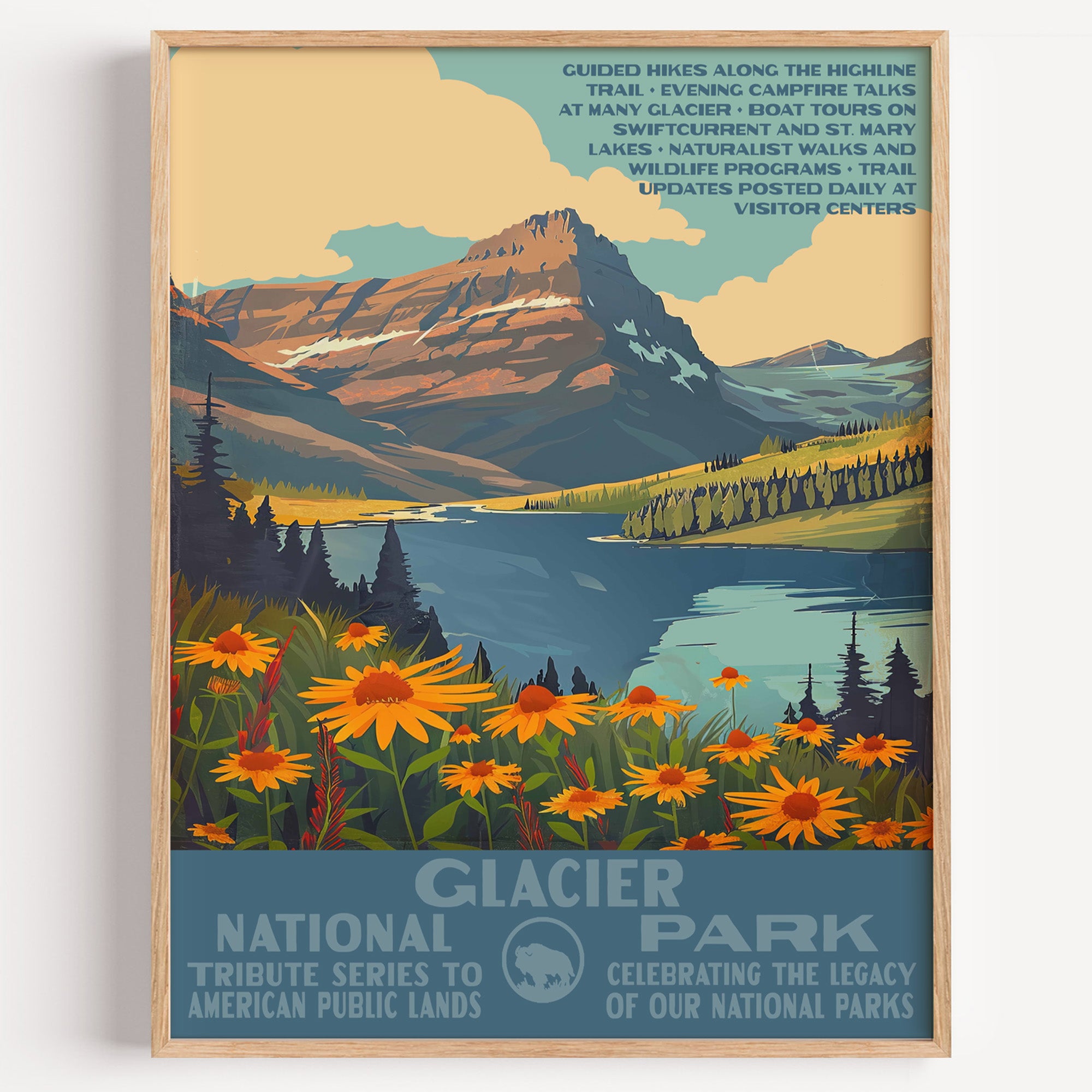 Glacier National Park wall art print in a thin wood frame, orange wildflowers along a lake below the Rocky Mountain peaks