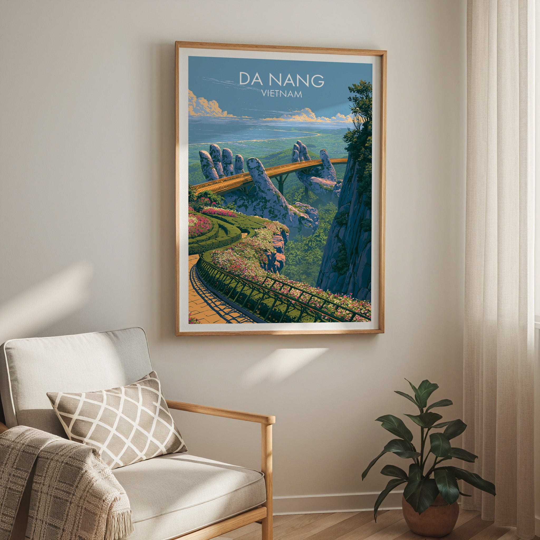 Golden Bridge Da Nang Vietnam travel print in a light oak frame on a living room wall beside a linen armchair