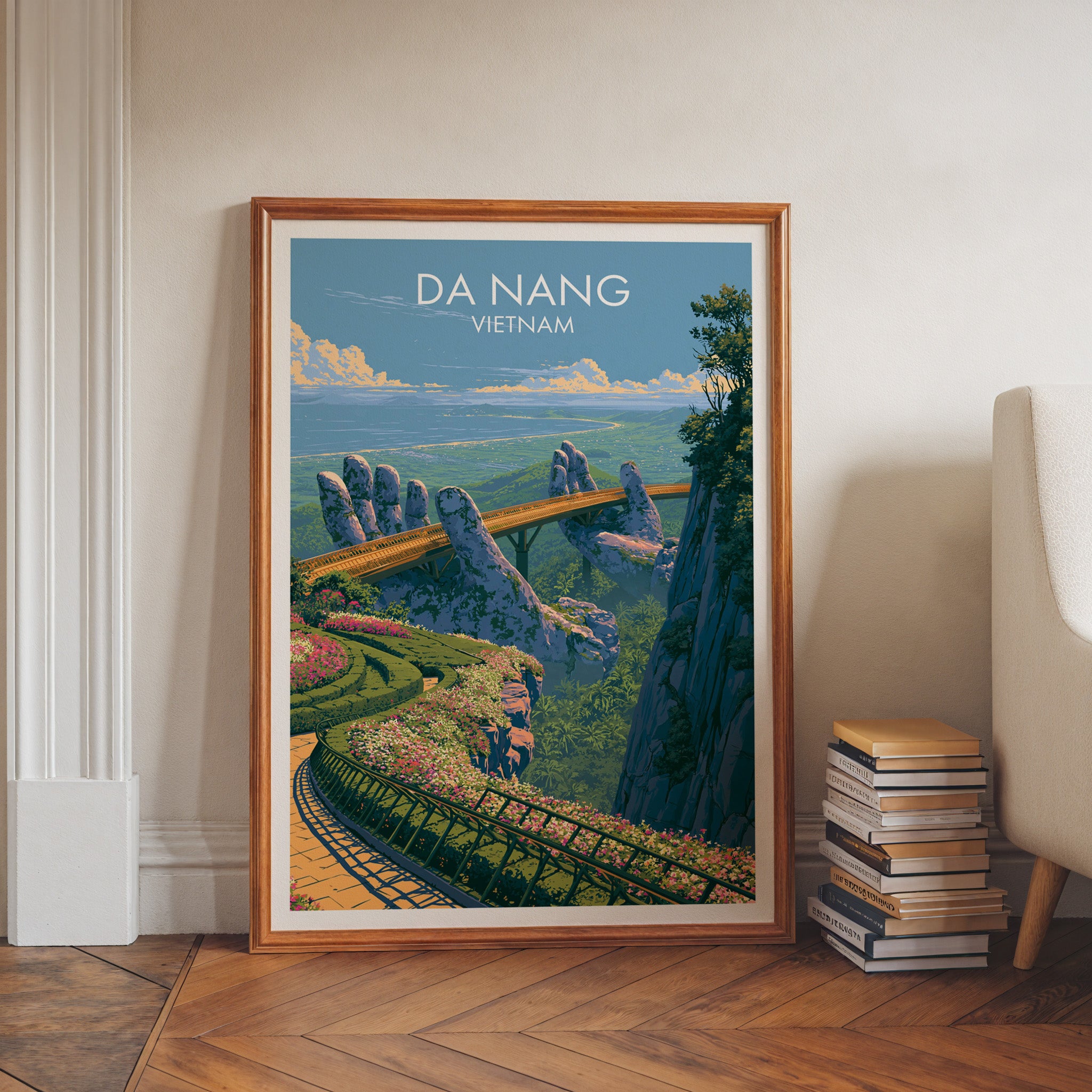 Golden Bridge Da Nang Vietnam art print in a walnut frame leaning in a hallway beside stacked books